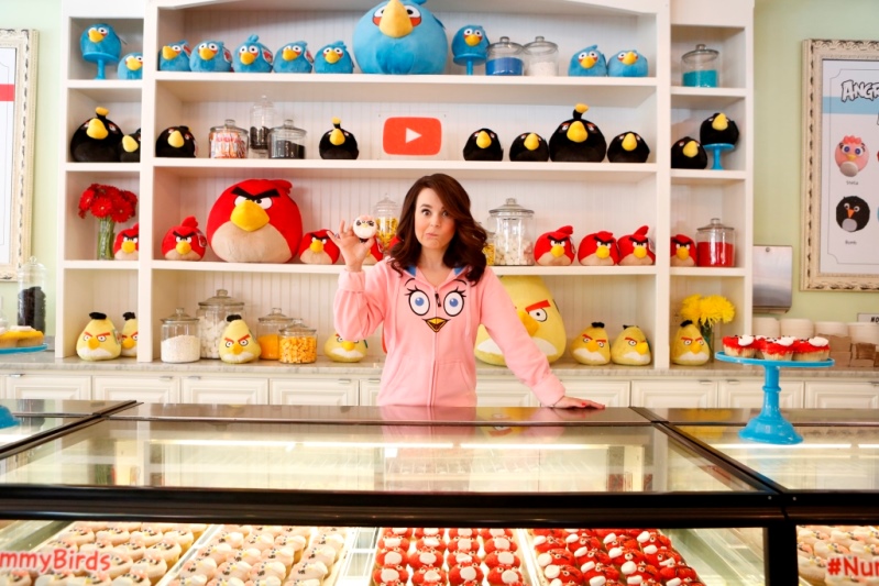 Rosanna Pansino holding a cupcake at Little Cupcake BakeShop Angry Birds Youtube Event